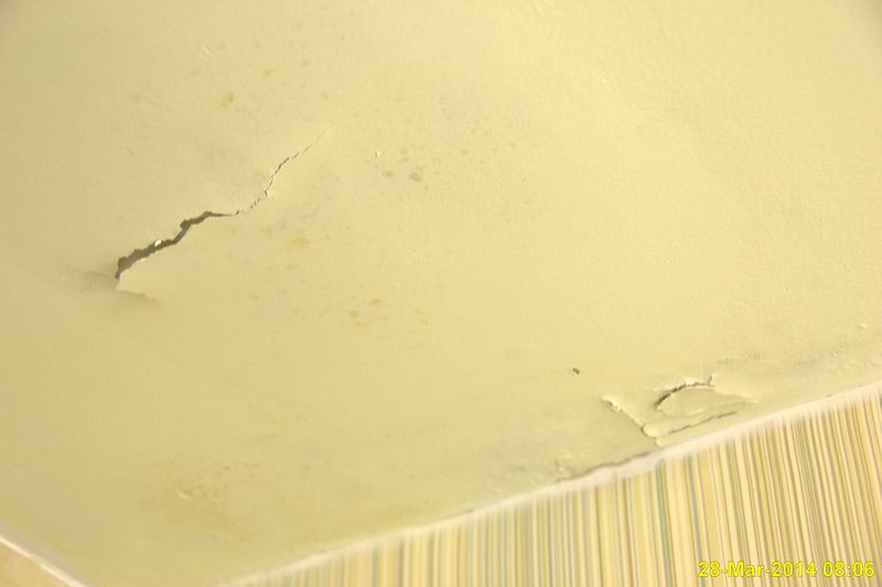 Drywall with mould after water damage in a hotel room