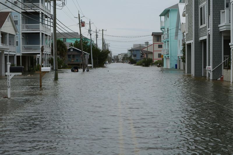 Residential street flooded between houses